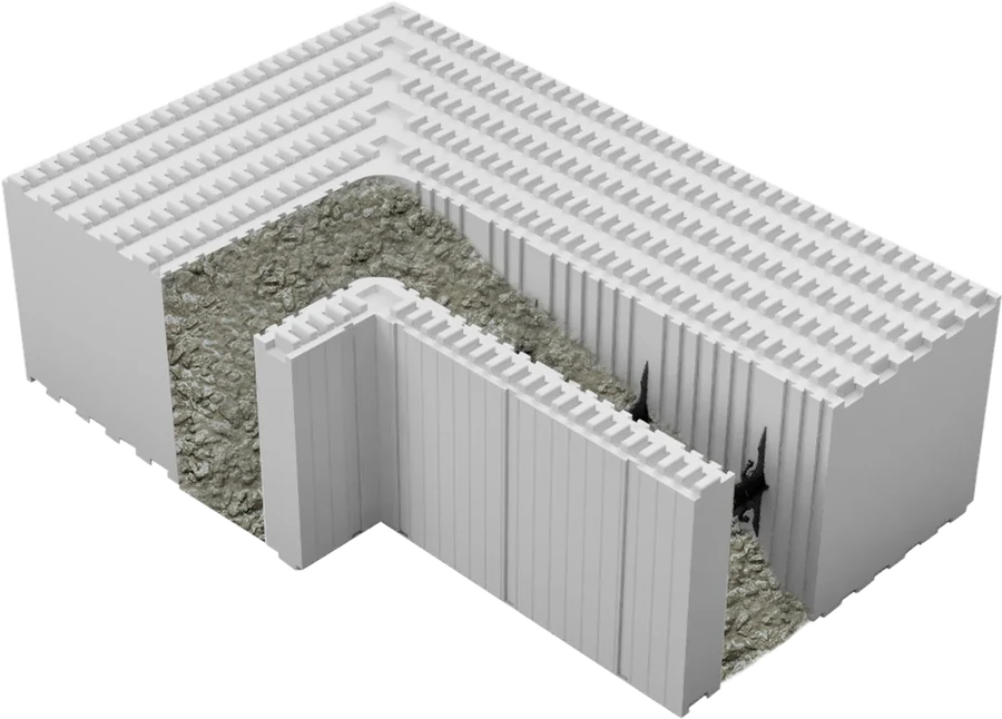 Coupe d’un angle de mur monté en blocs coffrants isolants Reverbloc de 52 cm